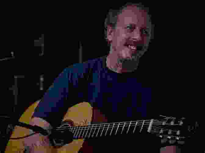 A Fingerstyle Guitarist Playing American Folk Music In A Rustic Setting. Global Adventures For Fingerstyle Guitarists