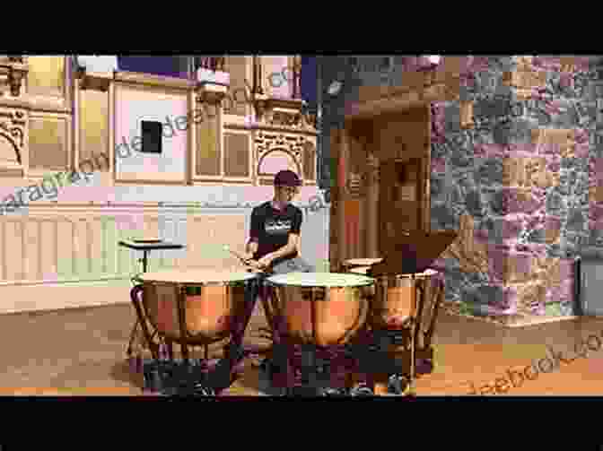 A Timpanist Performing A Solo Piece In A Concert Hall The Complete Timpani Method: Basic Theory * Technique * Intonation * Timpani Repertoire From The Classics