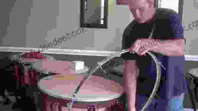 A Timpanist Using A Tuning Key To Adjust The Pitch Of A Timpani The Complete Timpani Method: Basic Theory * Technique * Intonation * Timpani Repertoire From The Classics