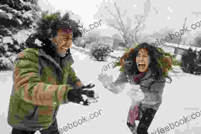 Anna And Jake Engage In A Playful Snowball Fight In The Town Square Of Christmas Creek Deck The Hearts (A Christmas Creek Romance 1)