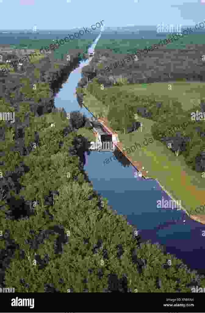 Modern Day Aerial View Of The Erie Canal, Showcasing Its Integration With Urban Landscapes And Vibrant Waterfront Communities Erie Canal Sings The: A Musical History Of New York S Grand Waterway