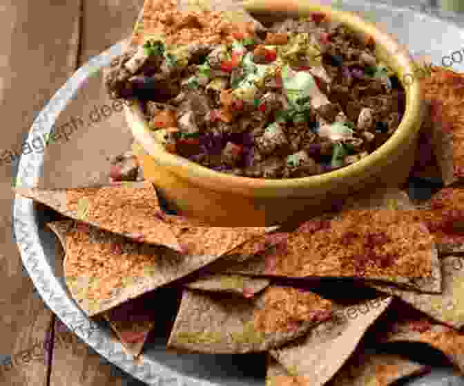 Plate Of Nachos With Red Tortilla Chips, Black Bean Dip, And Vampire Shaped Tortilla Chips Adventure Time Recipes: How To Make Intriguing And Delectable Meals Inspired By Adventure Time