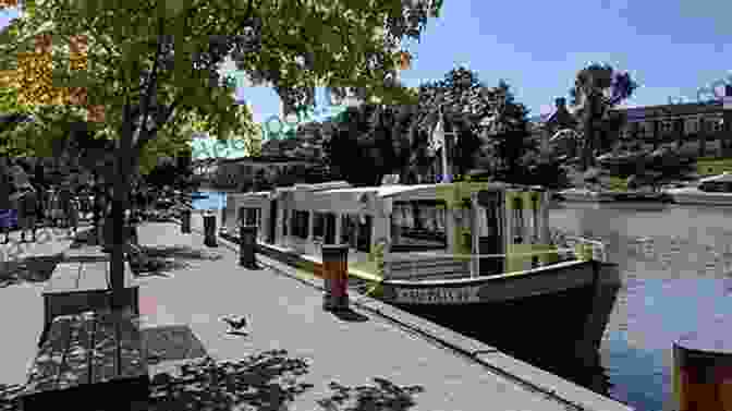 Tourists Enjoying A Leisurely Boat Ride Along The Erie Canal, Admiring Its Scenic Beauty And Historical Significance Erie Canal Sings The: A Musical History Of New York S Grand Waterway